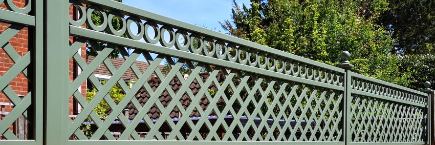 Bespoke diagonal trellis panels with decorative detailing painted in Greenwich Green
