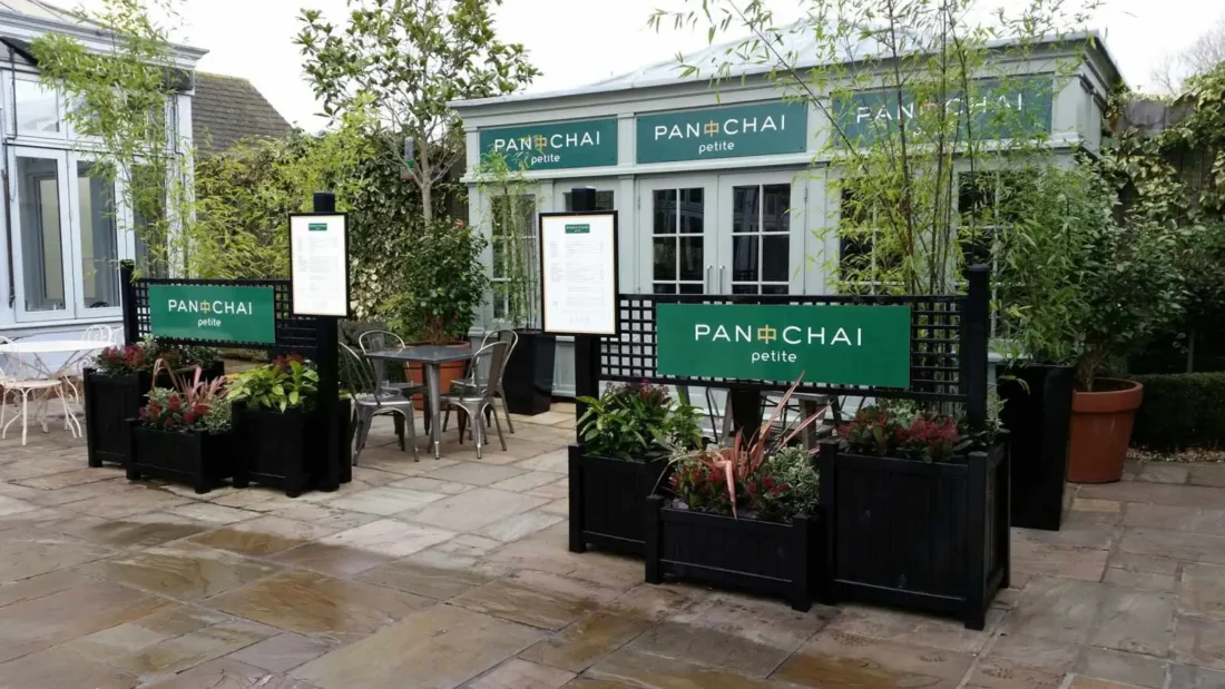 Bespoke black planters and fence panels - Pan Chai petite at Bicester Village, Oxfordshire