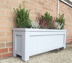 A contemporary planter with an assortment of heathers and evergreens