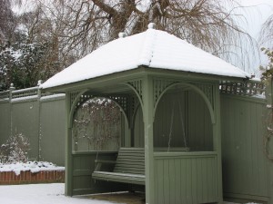 Painted seating arbour, perfect in any weather