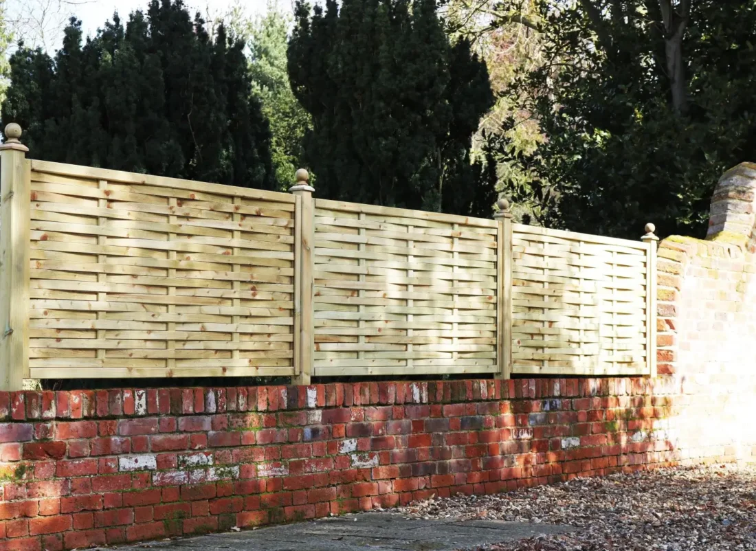 Weave Panels in natural Softwood installed atop a wall using Studded Fence Posts