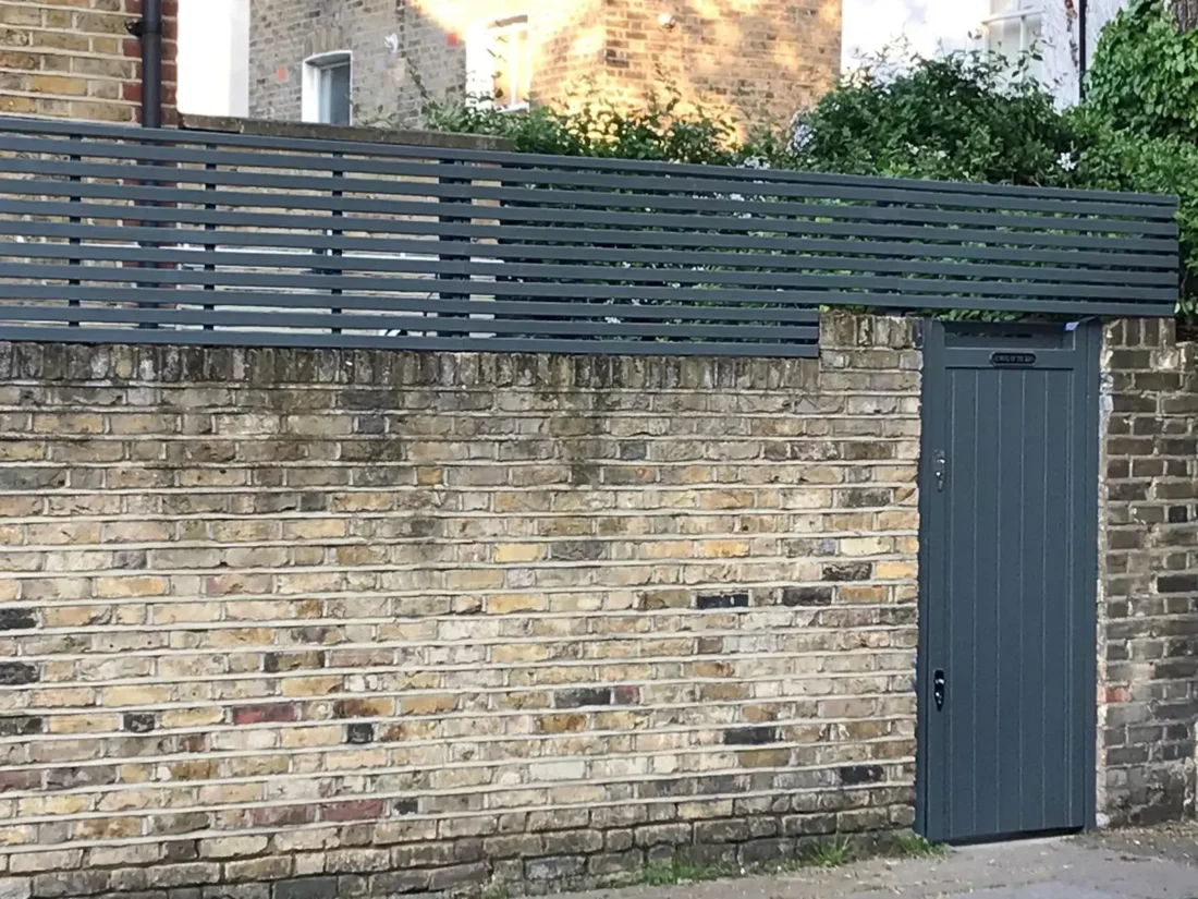 Ready-made slatted panels cut and customised with client’s paint to match their gate