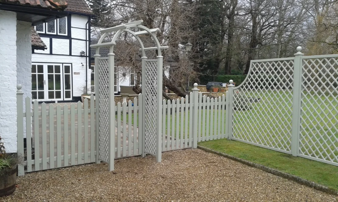 Rose Arch with Diagonal Trellis Panel inserts and Concave Pointed Top Picket Fence Panels painted Manhattan Grey