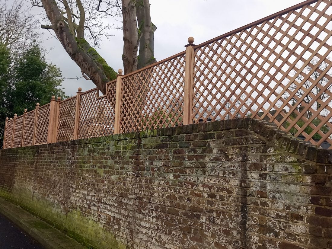 Bespoke diagonal trellis panels with a 68mm gap in Iroko